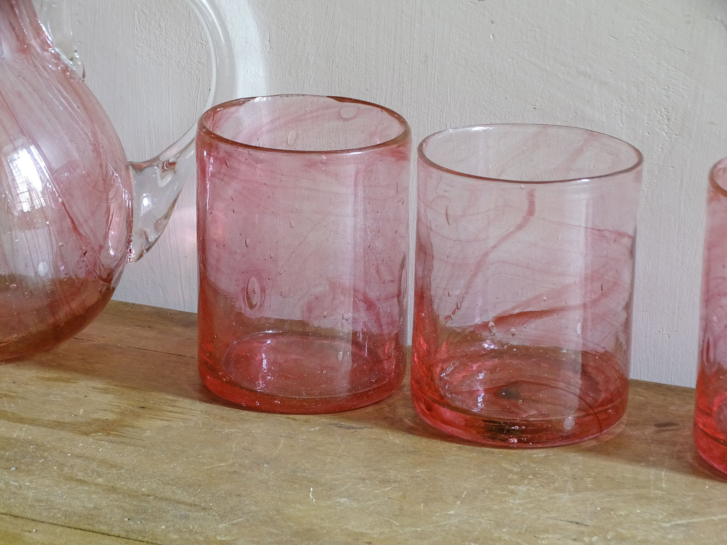 Vintage pink glass drinking set with pitcher and matching glasses