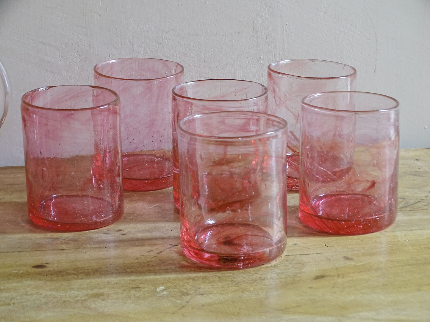 Hand-blown pink glass pitcher with six drinking tumblers