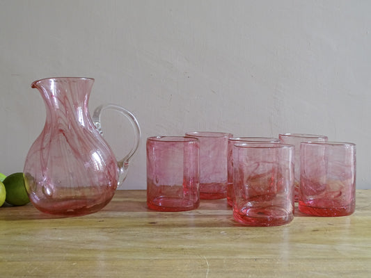 Vintage hand-blown pink glass pitcher with six matching tumblers