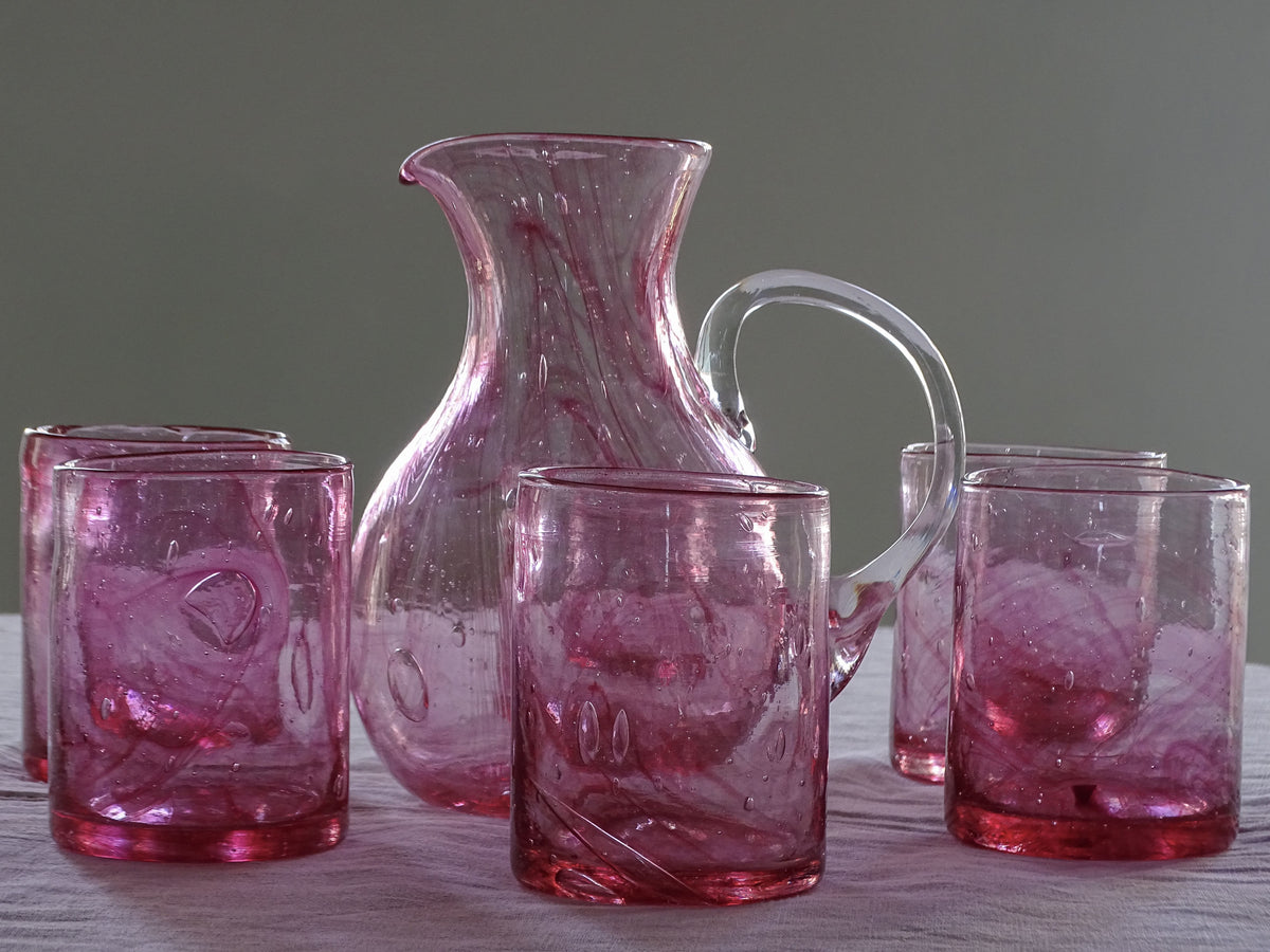 Complete seven-piece hand-blown pink glass drinking set