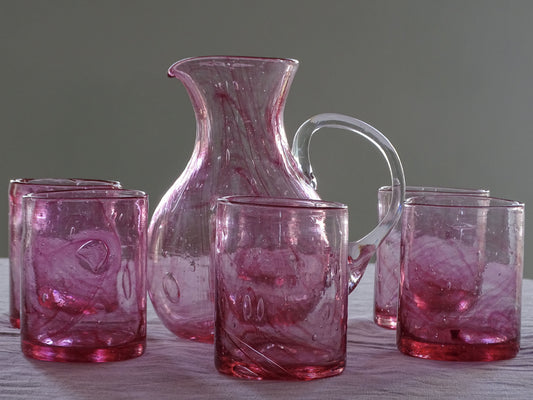 Complete seven-piece hand-blown pink glass drinking set