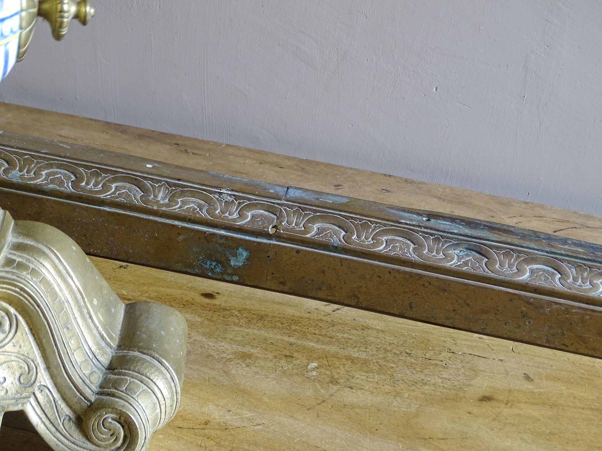 Pair of 19th century French brass fireplace chenets with polychrome ceramic centres