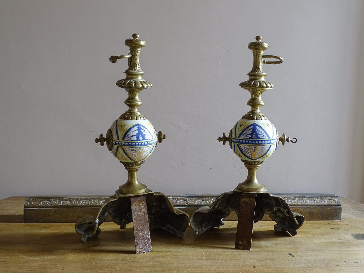 Late 19th century French fireplace set with brass chenets and matching fender