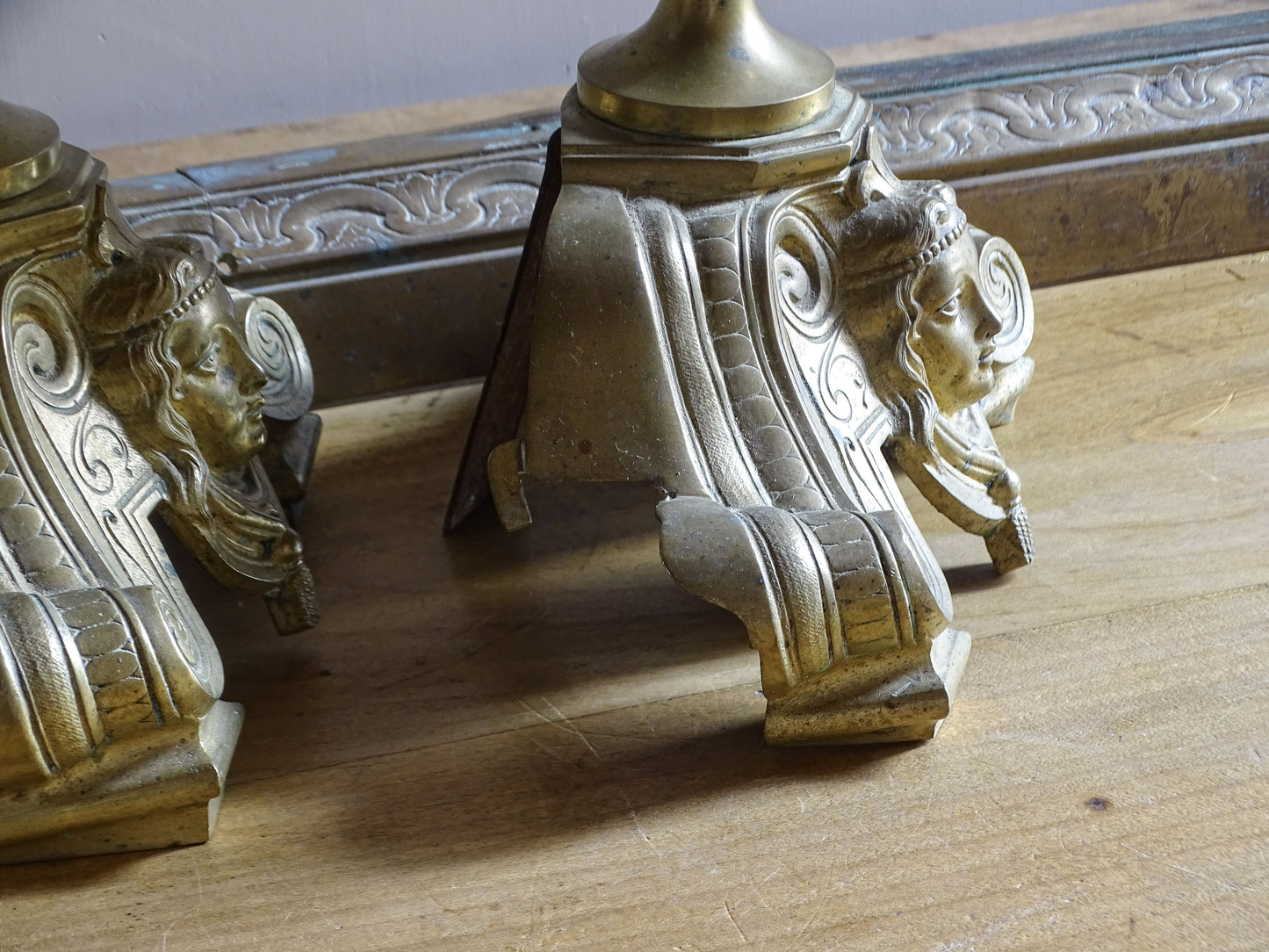 French c.1880 fireplace chenets with scrollwork bases and hand-painted ceramic decoration