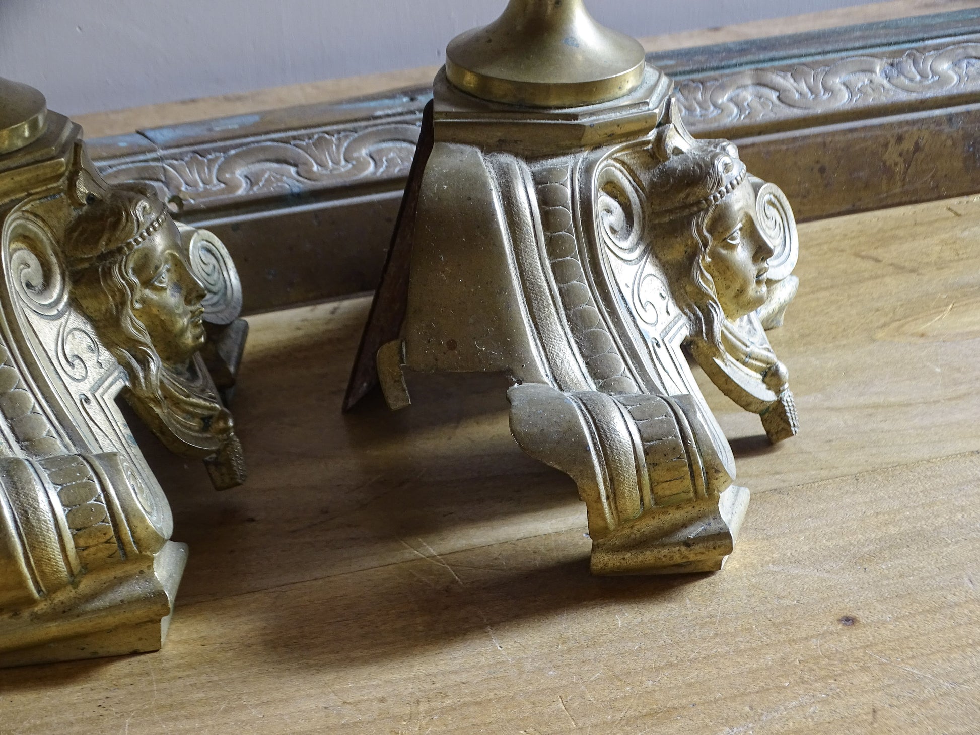 French c.1880 fireplace chenets with scrollwork bases and hand-painted ceramic decoration
