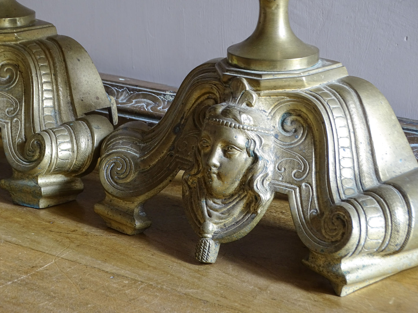 Antique French brass landier with porte-broche fitting and naturally aged surface