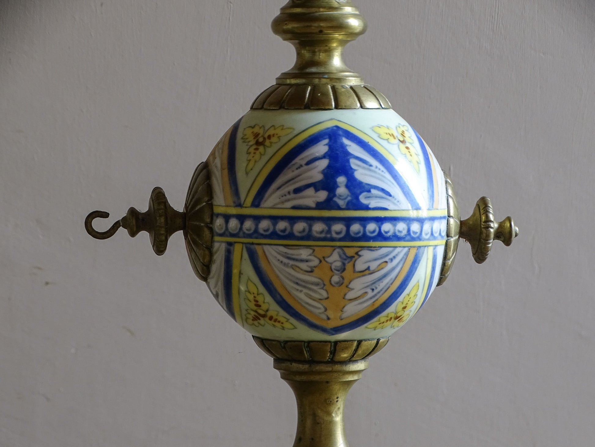 Decorative 19th century French andirons with blue yellow and white ceramic globes
