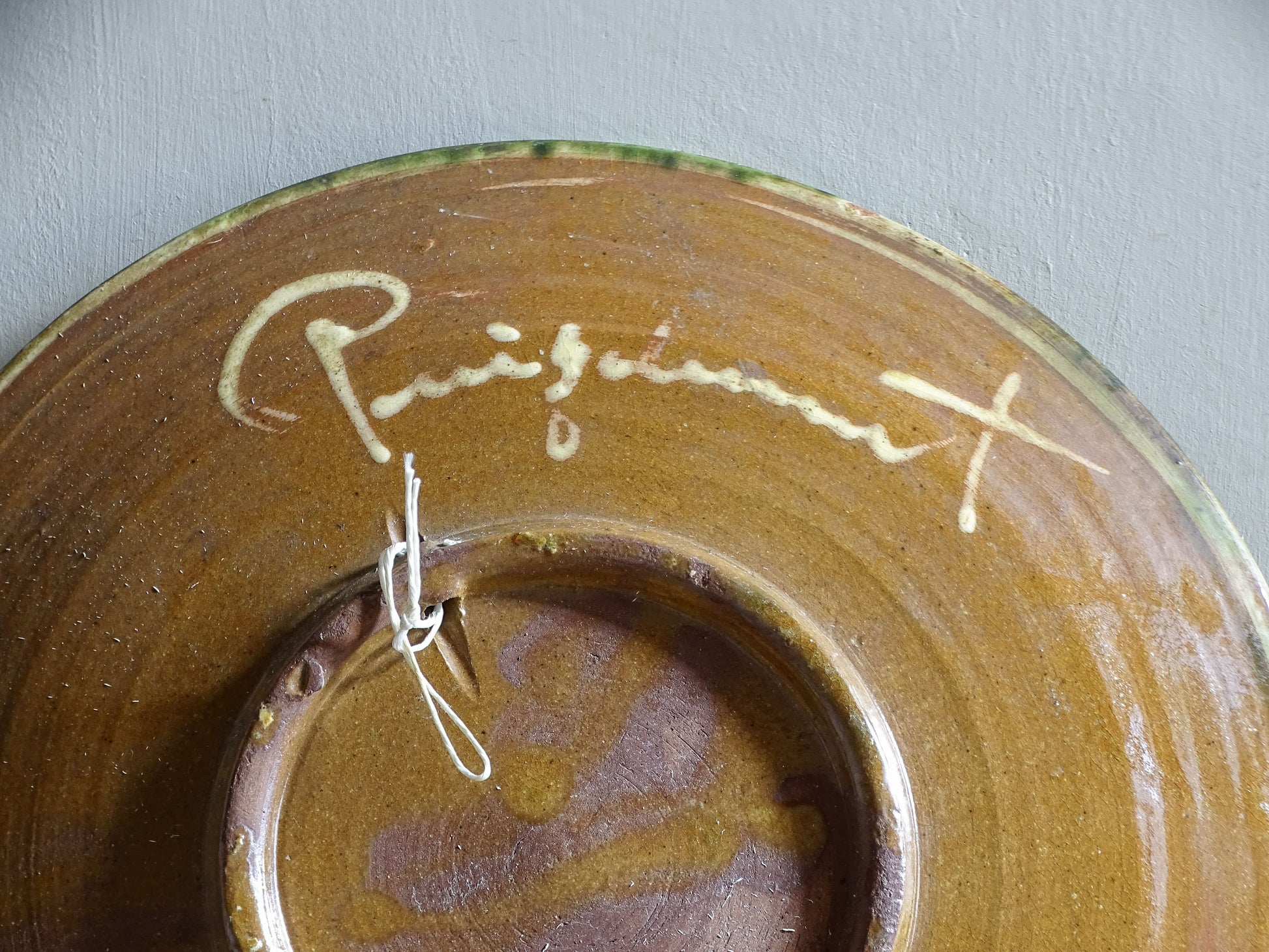 Vintage Catalan glazed pottery plate with colourful fish motif