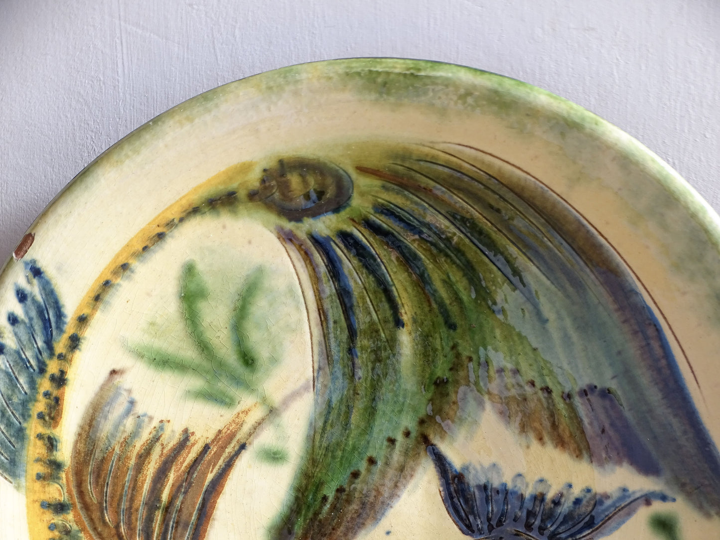 Spanish ceramic fish plate in green, yellow and blue glazes