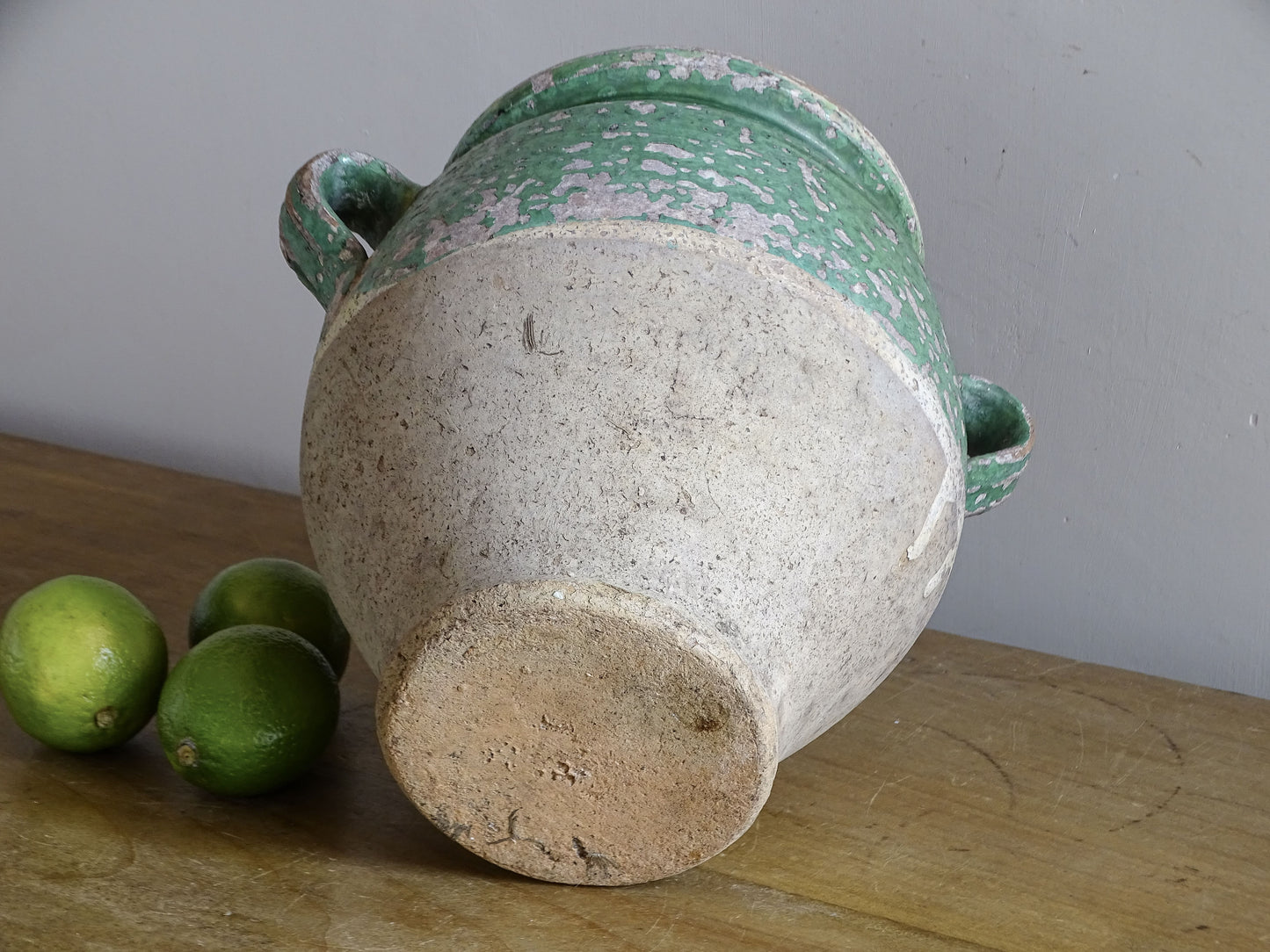 Base of antique French confit pot with green glaze