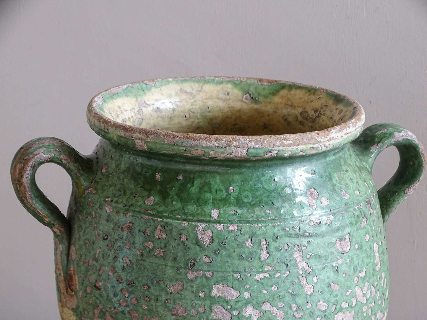 Antique French confit pot with worn green glaze