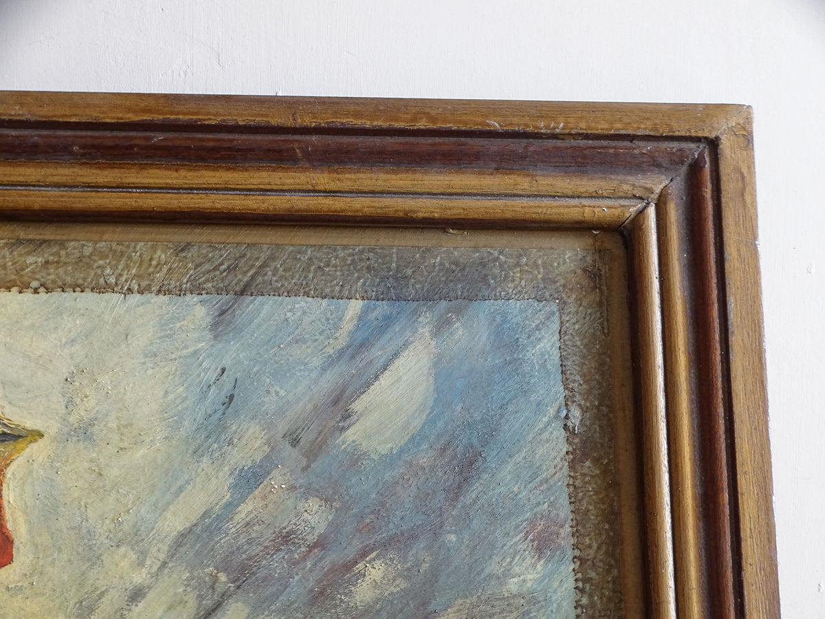 Detail of worn moulded wooden frame surrounding French rooster oil painting
