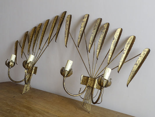 Side view of a pair of Spanish mid-century gilt metal wall lights showing their sculptural depth