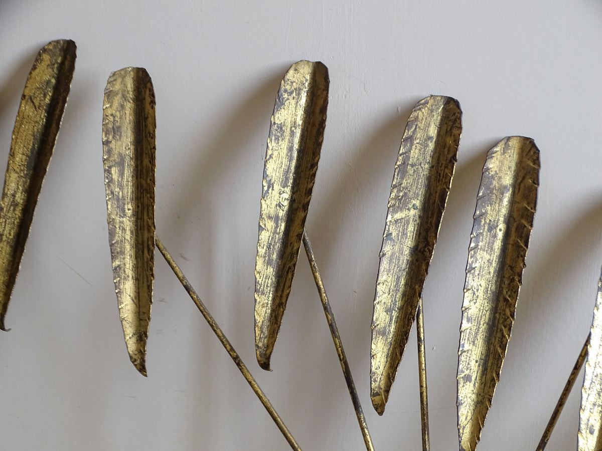 Detail of the sculptural gilt metal leaf design on a Spanish mid-century wall light