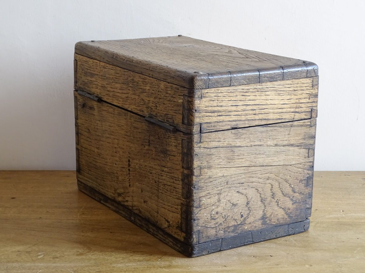 19th century French oak box with exposed finger joints and shaped metal clasp