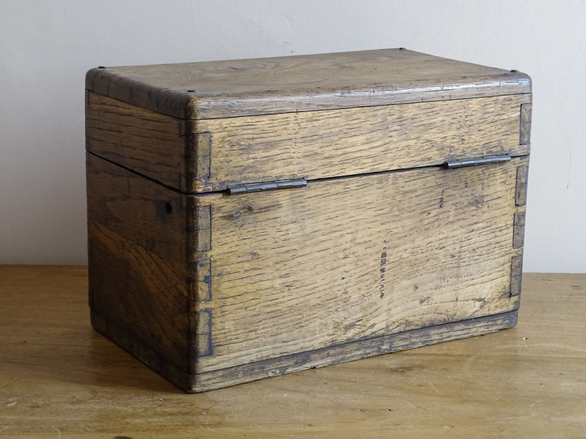 19th century French oak box with exposed finger joints and shaped metal clasp