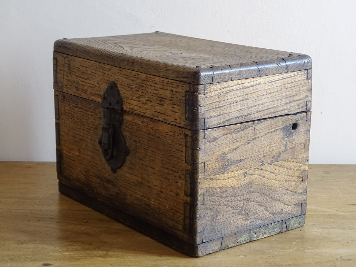 19th century French oak box with exposed finger joints and shaped metal clasp
