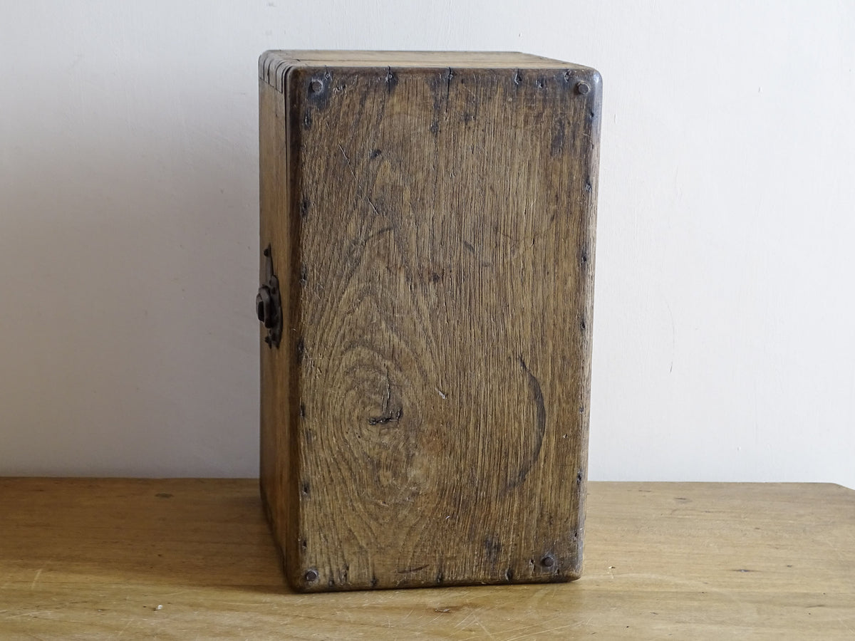 19th century French oak box with exposed finger joints and shaped metal clasp
