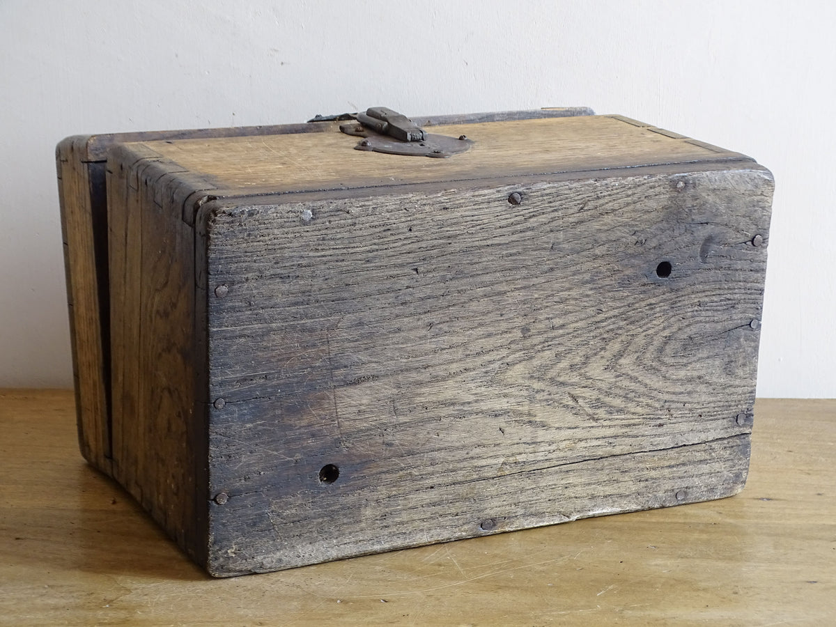19th century French oak box with exposed finger joints and shaped metal clasp
