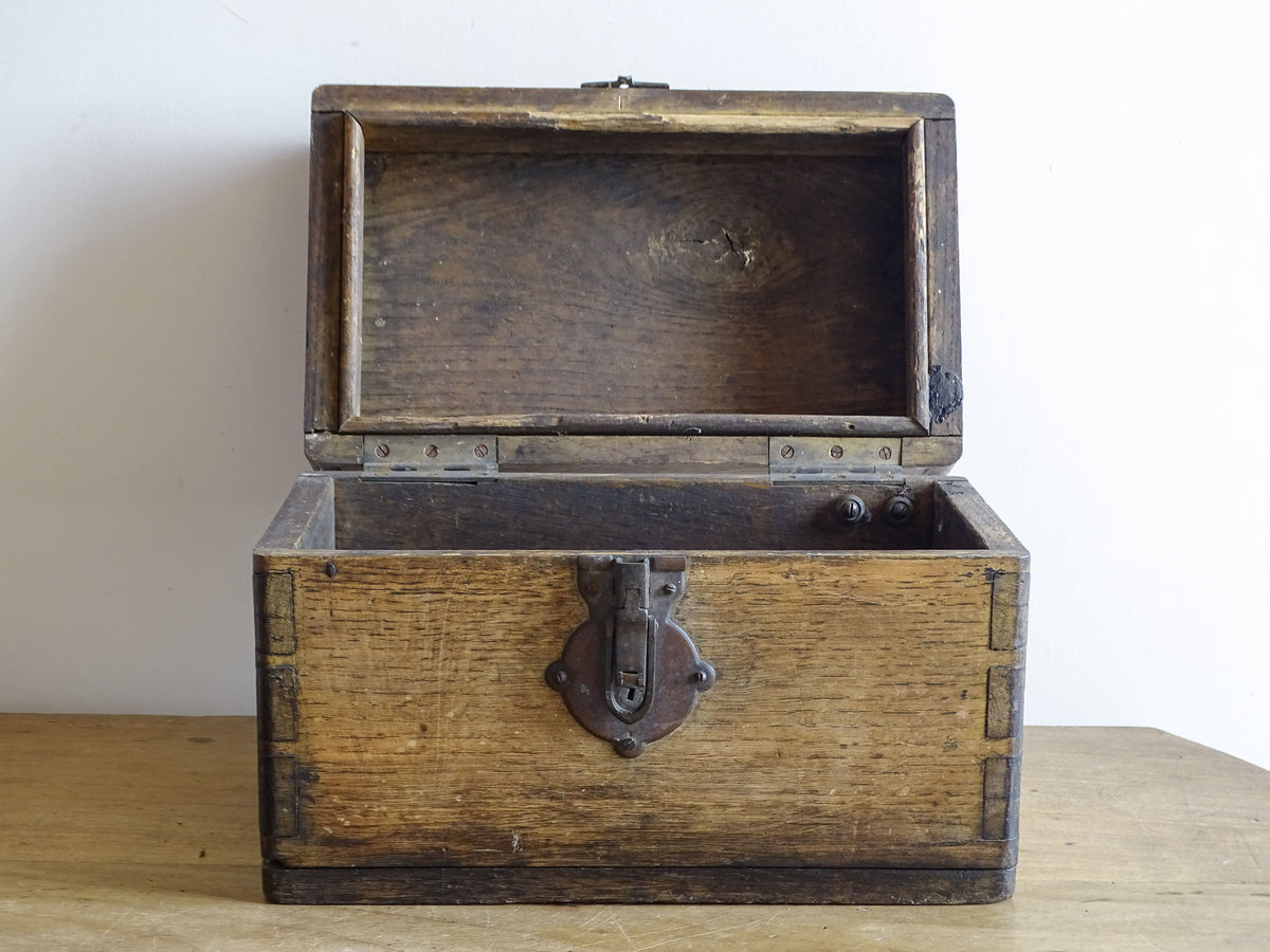 19th century French oak box with exposed finger joints and shaped metal clasp
