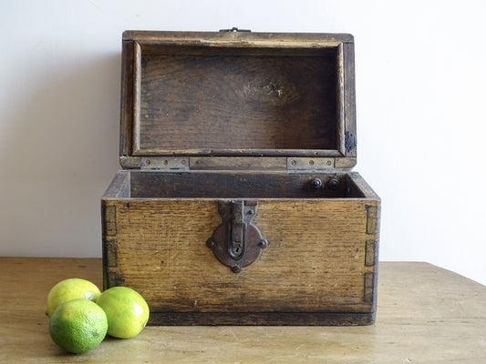 19th century French oak box with exposed finger joints and shaped metal clasp