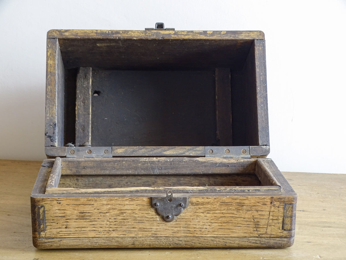 19th century French oak box with exposed finger joints and shaped metal clasp