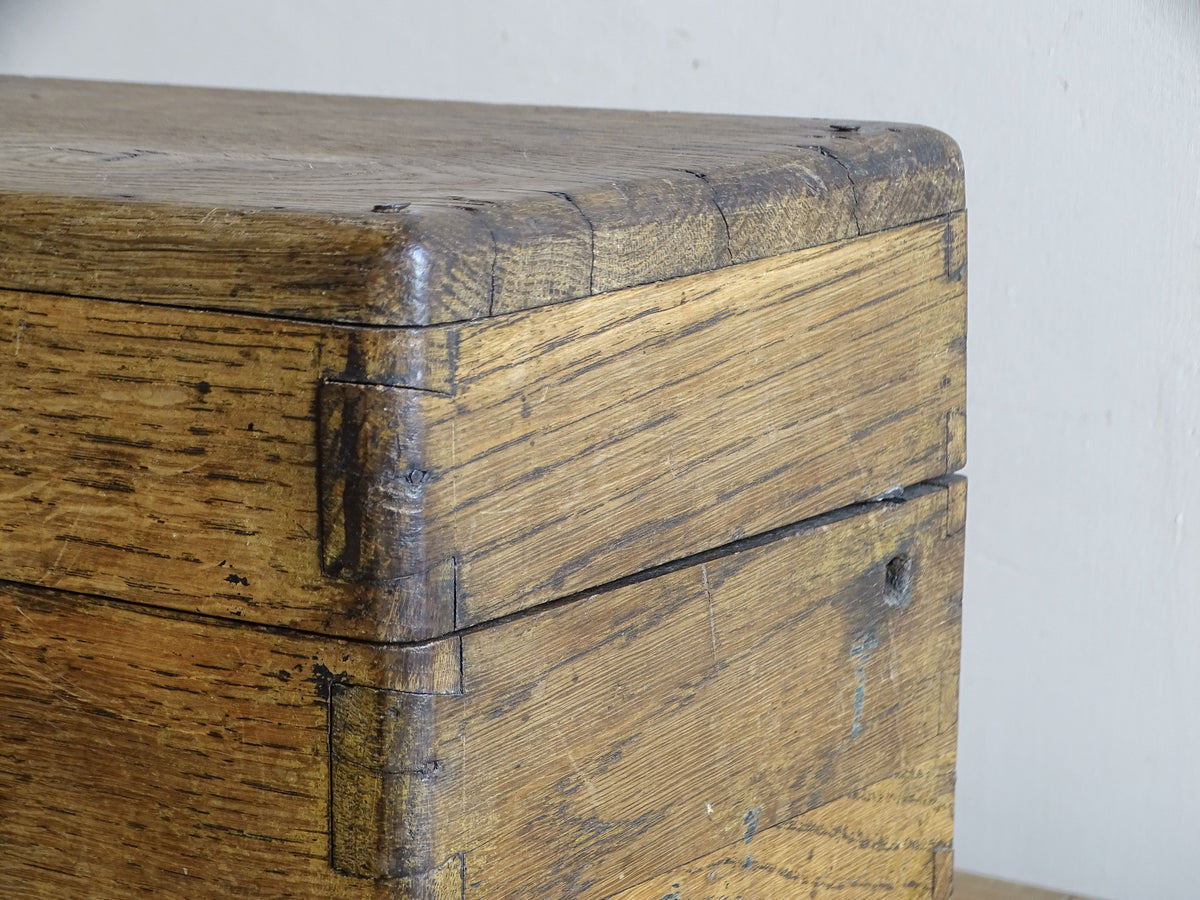 19th century French oak box with exposed finger joints and shaped metal clasp