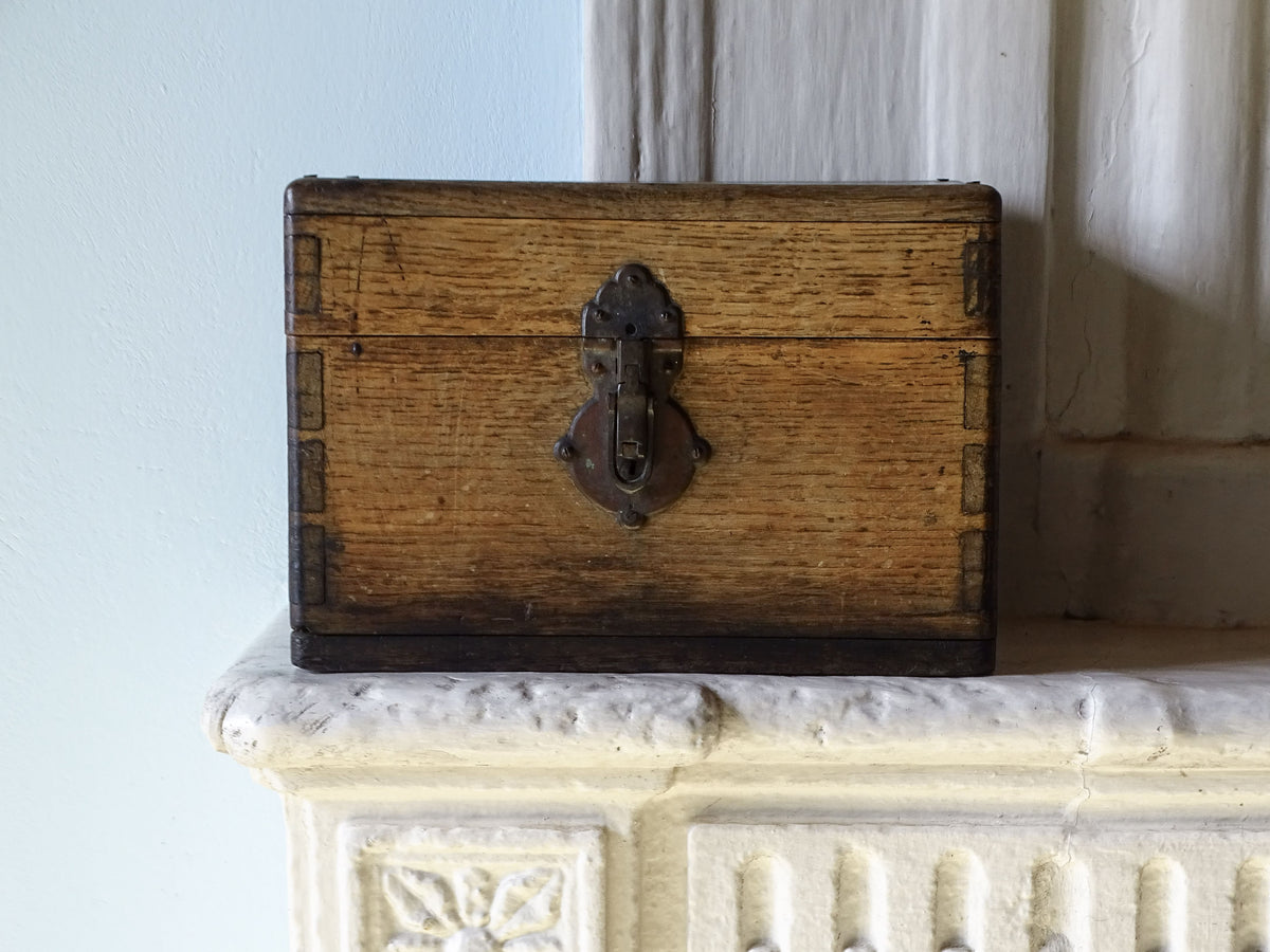 19th century French oak box with exposed finger joints and shaped metal clasp