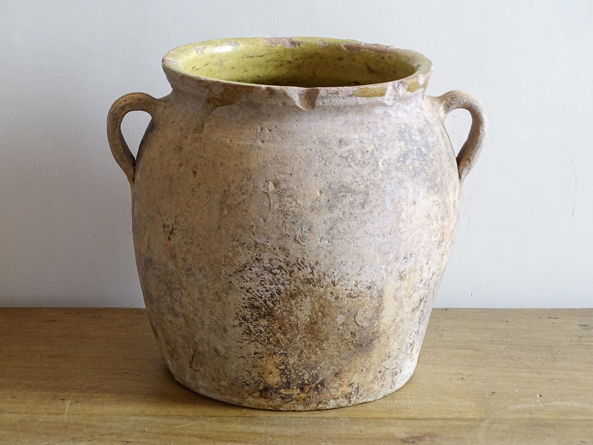 Antique French two-handled confit pot with rustic unglazed exterior