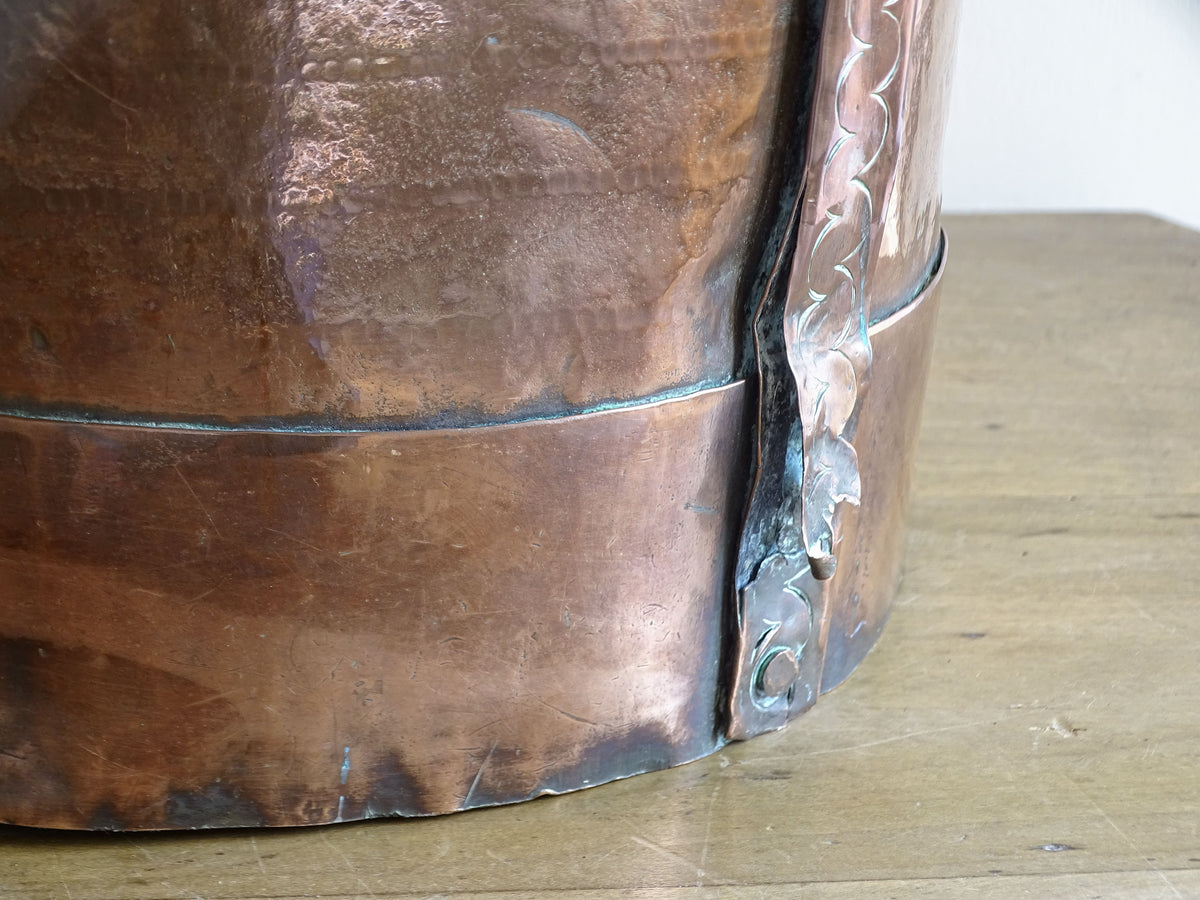 Hand-punched decorative strap and rivets on an 18th century French copper ferrat