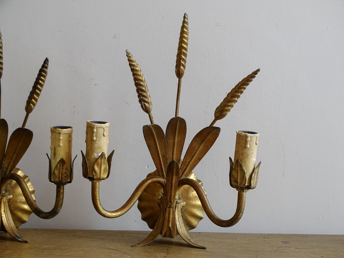 French gilt metal wheat sheaf wall sconces shown together as a matched pair