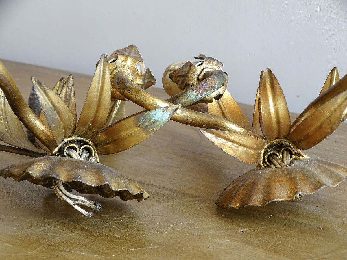 Rear view of vintage French gilt metal wall lights showing backplates and original wiring