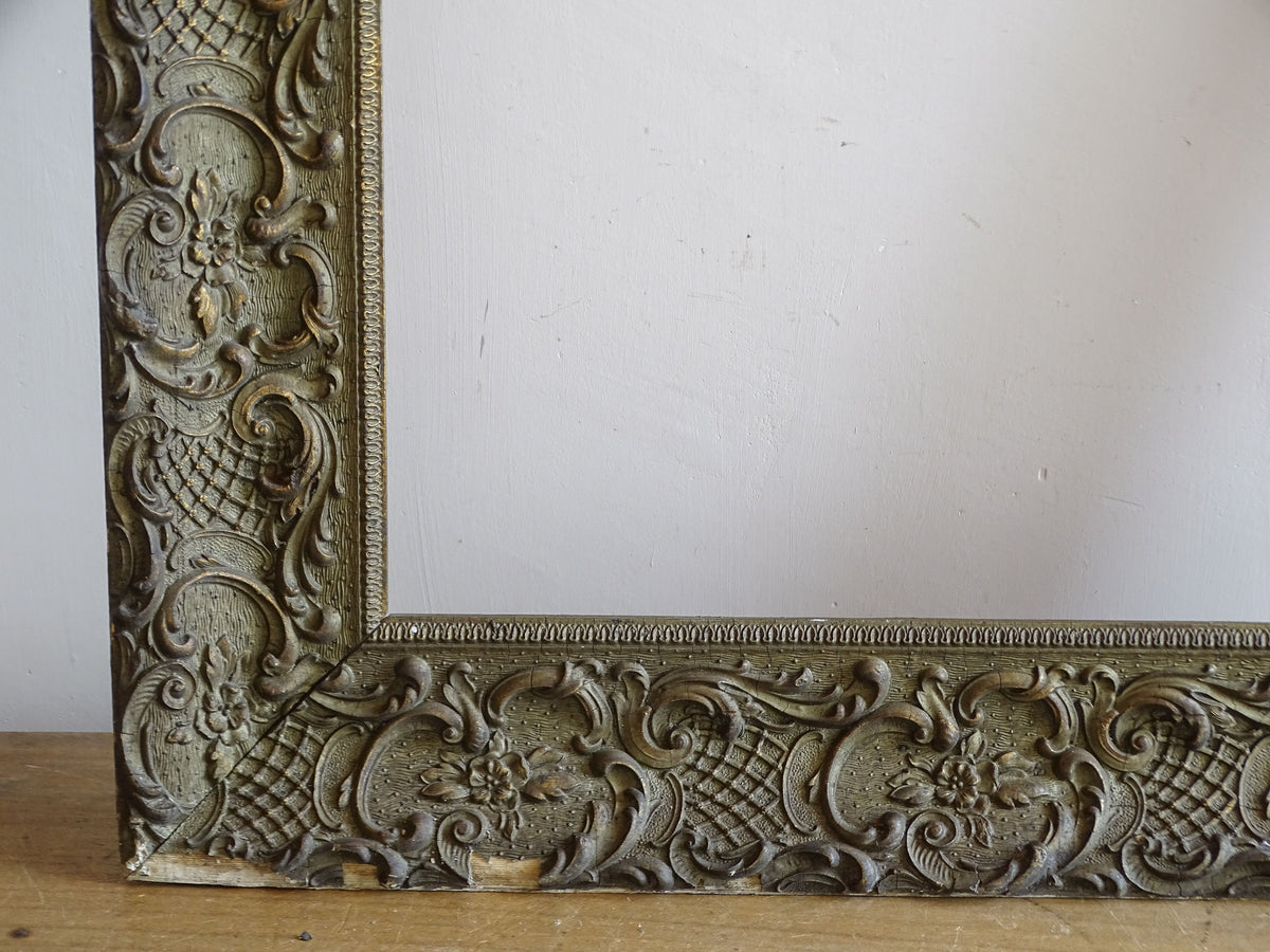 Lower left corner detail of French Louis XV style frame with flowers, scrolling foliage and trellis motifs