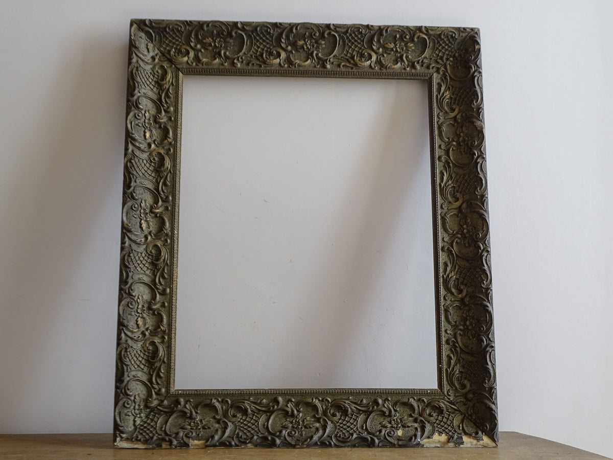 Full view of French 19th-century ornate Louis XV style frame with aged green-grey and gilt finish