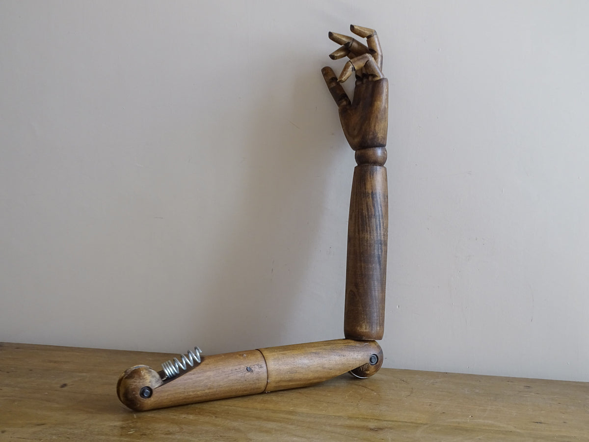 Full view of an 82 cm mid-century articulated wooden mannequin arm with sprung shoulder fitting