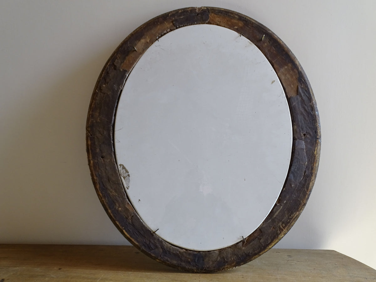 Reverse of 19th-century French floral painting on an oval ceramic plaque