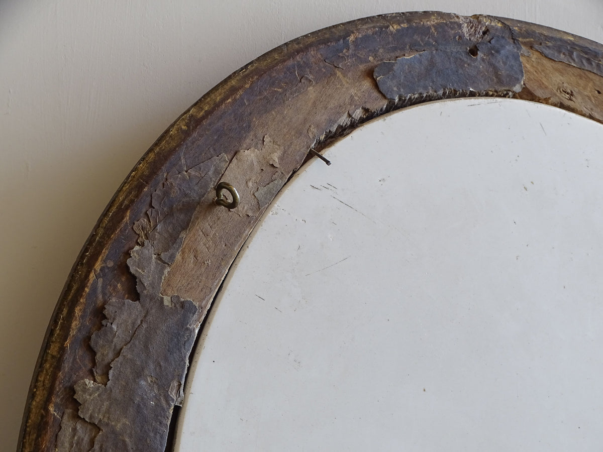 Detail of antique frame reverse showing old backing remnants and hanging fitting