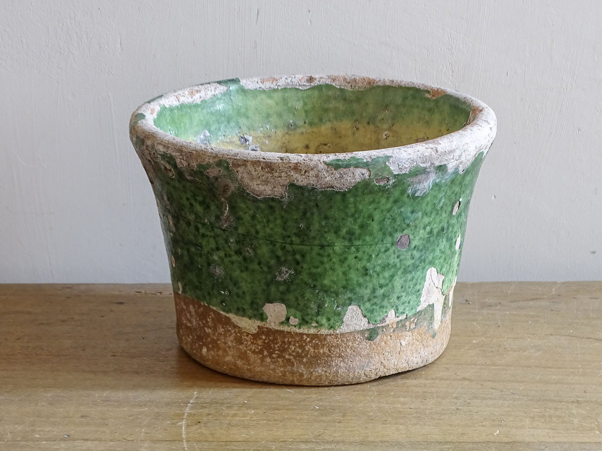 Interior of antique French green glazed pottery pot