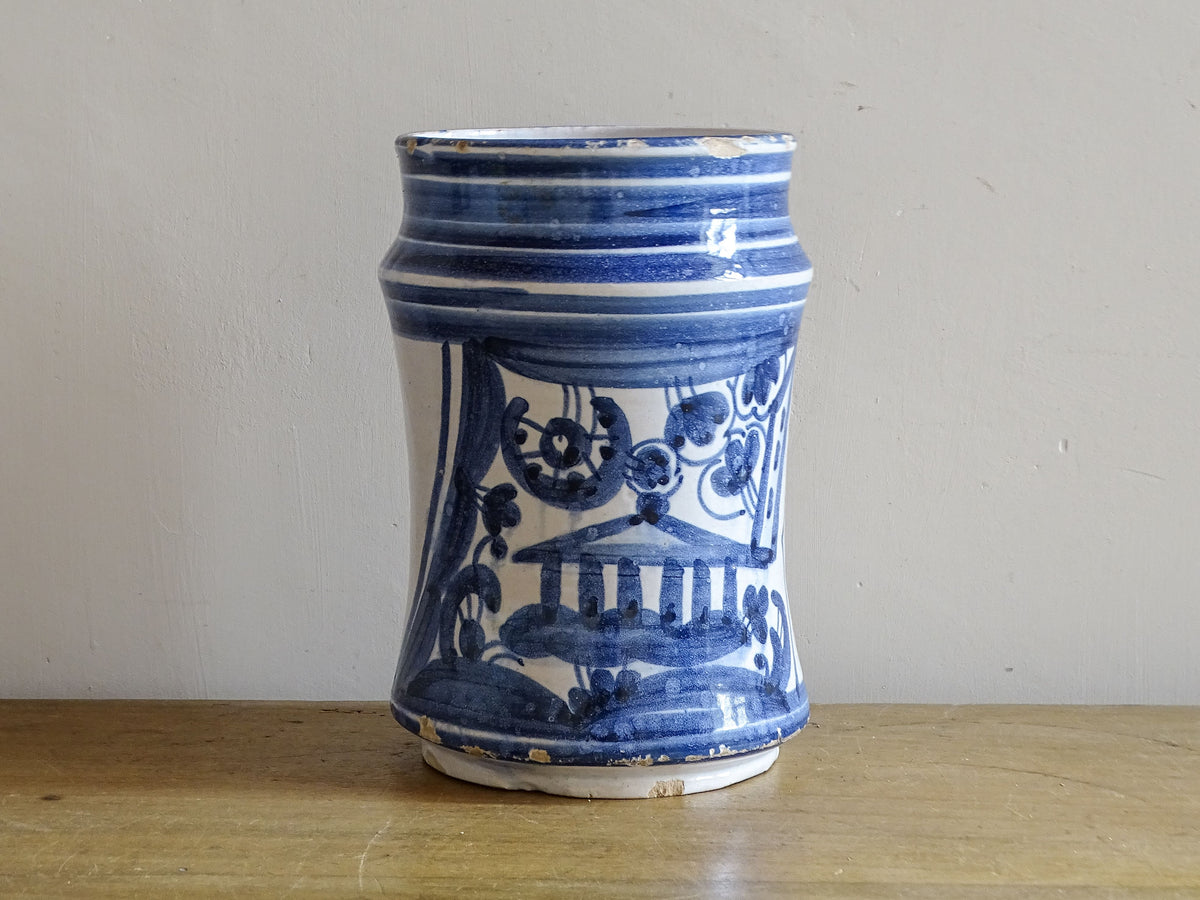 Antique Spanish blue and white albarello with hand-painted architectural decoration