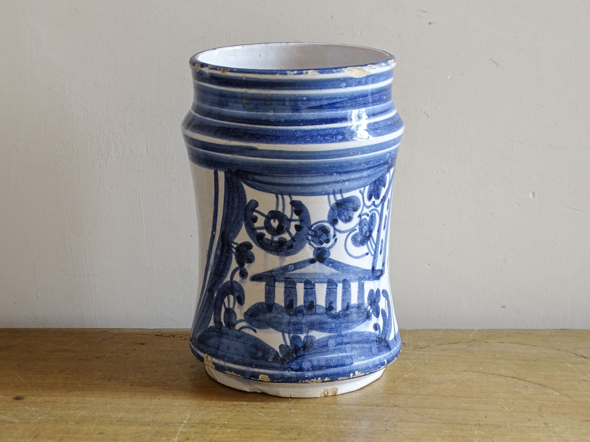 Antique Spanish blue and white albarello with hand-painted architectural decoration