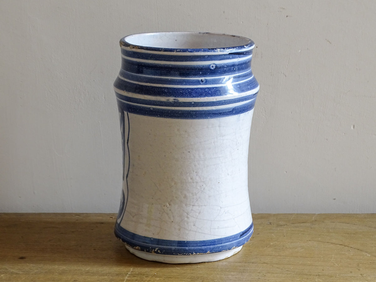 Reverse view of 19th-century Spanish albarello with white tin glaze and blue banding