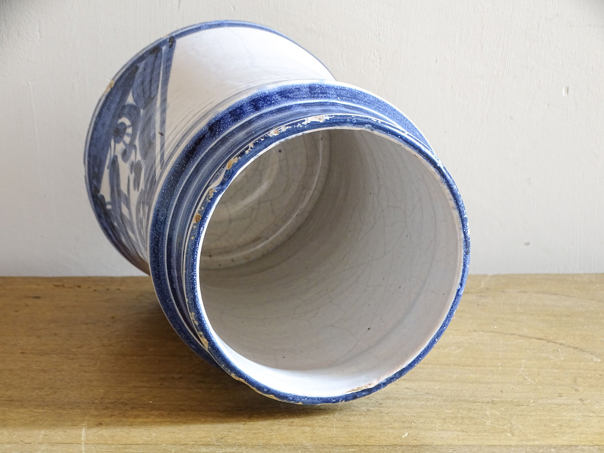 Interior of 19th-century Spanish albarello showing crazed white glaze and worn rim