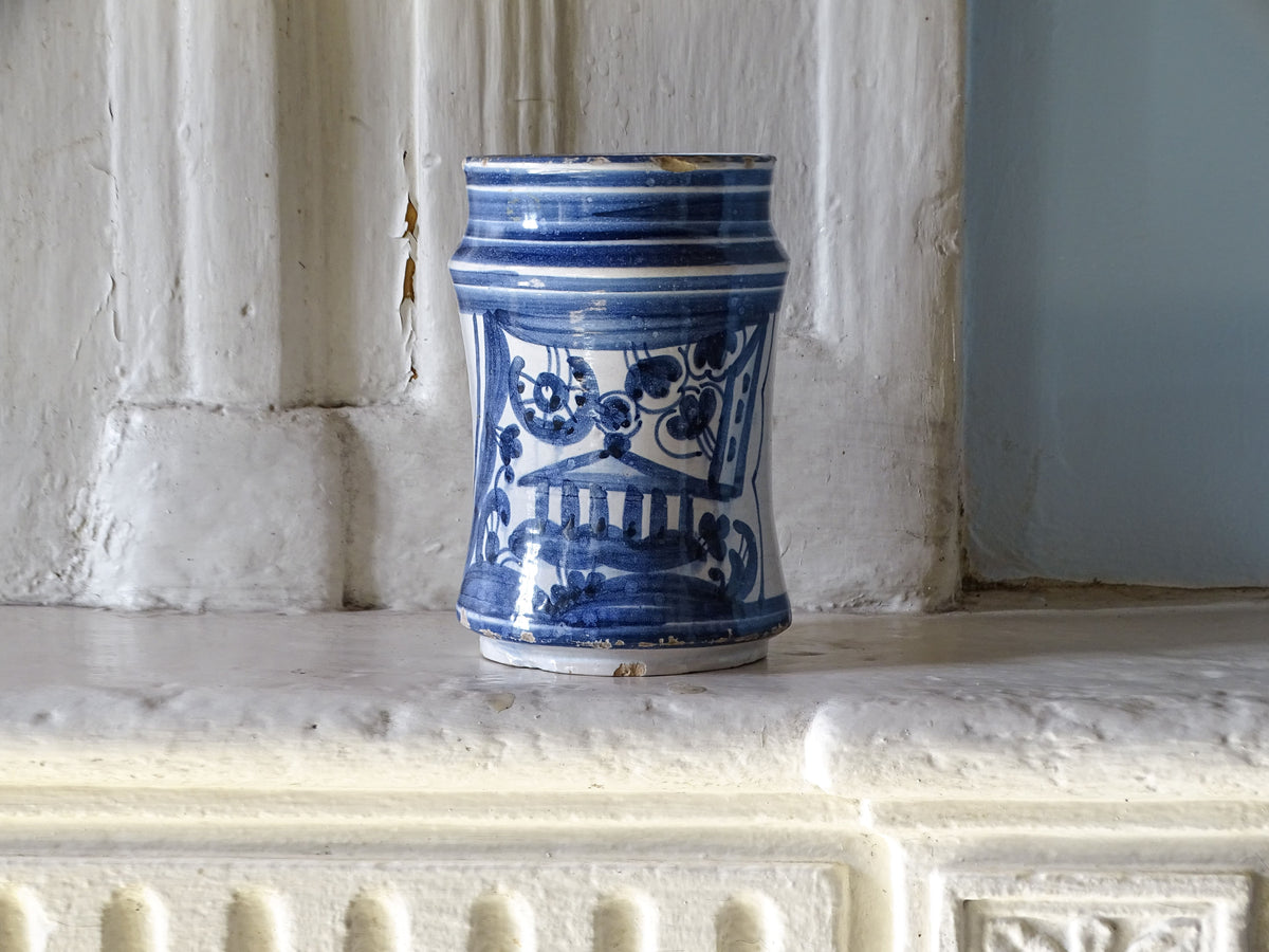 Antique Spanish blue and white albarello with hand-painted architectural decoration