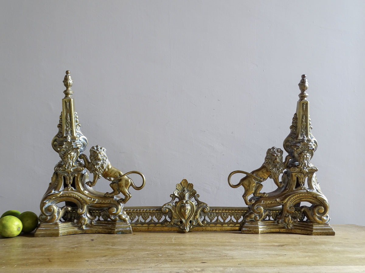 French Napoleon III brass fireplace fender with lions displayed in an interior
