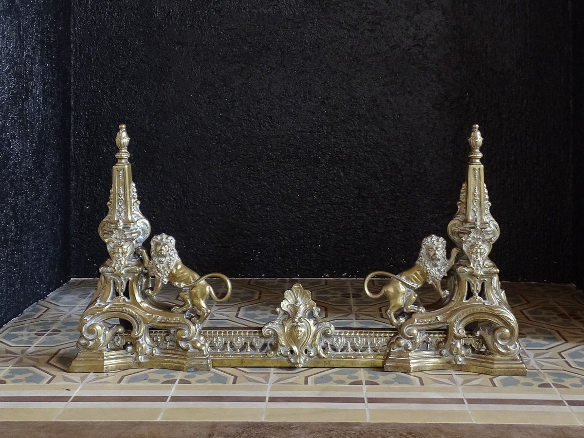 Ornate 19th century brass fireplace fender with lions and scrolling decoration