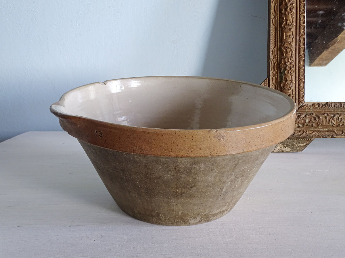 Large French vintage stoneware mixing bowl with a cream-glazed interior, caramel rim and pouring spout.