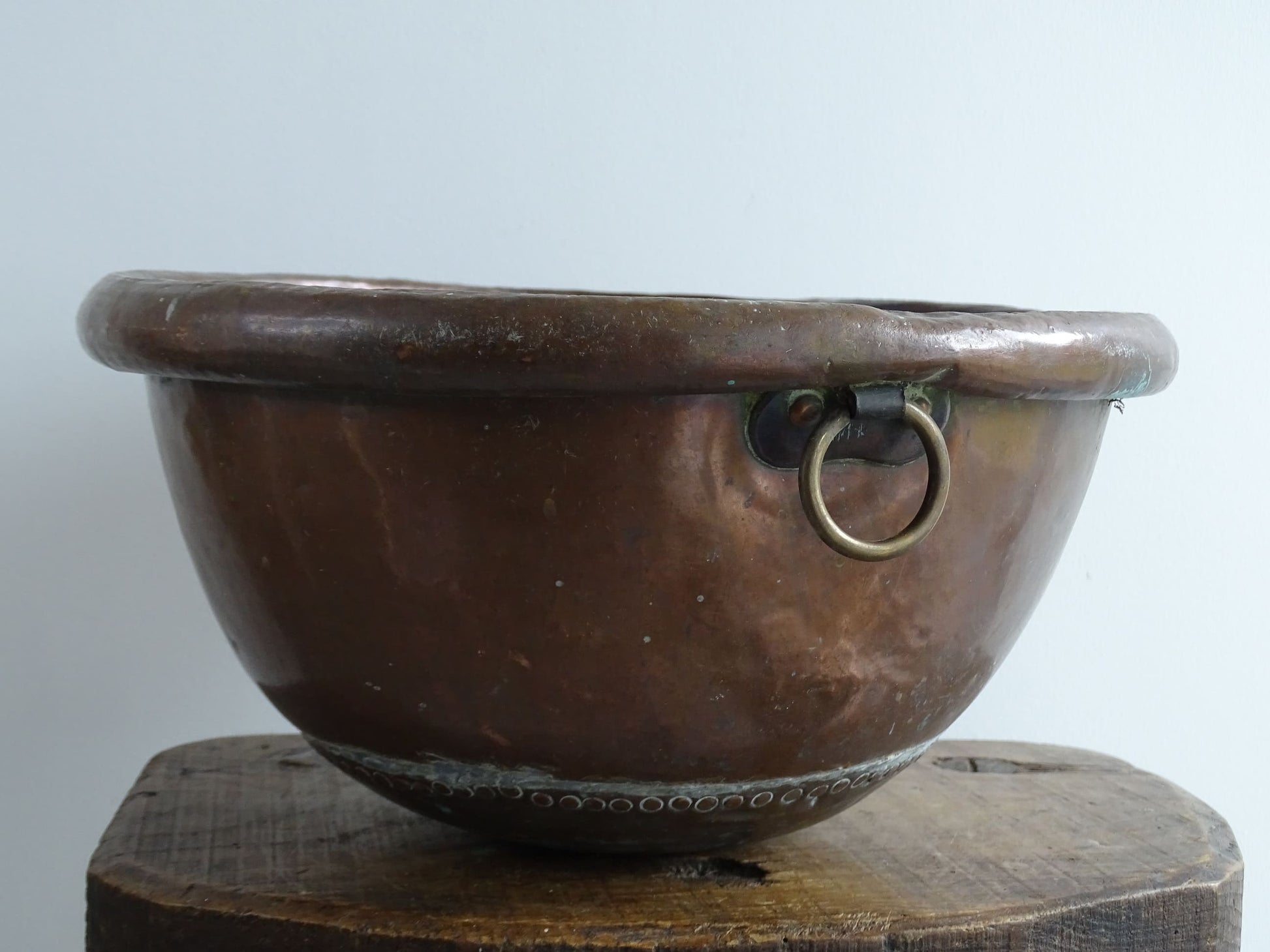 Antique French Copper Confectioner's or Mixing Bowl from the 18th Century. This timeworn copper bowl has a rolled top and copper rivets to the curved base.