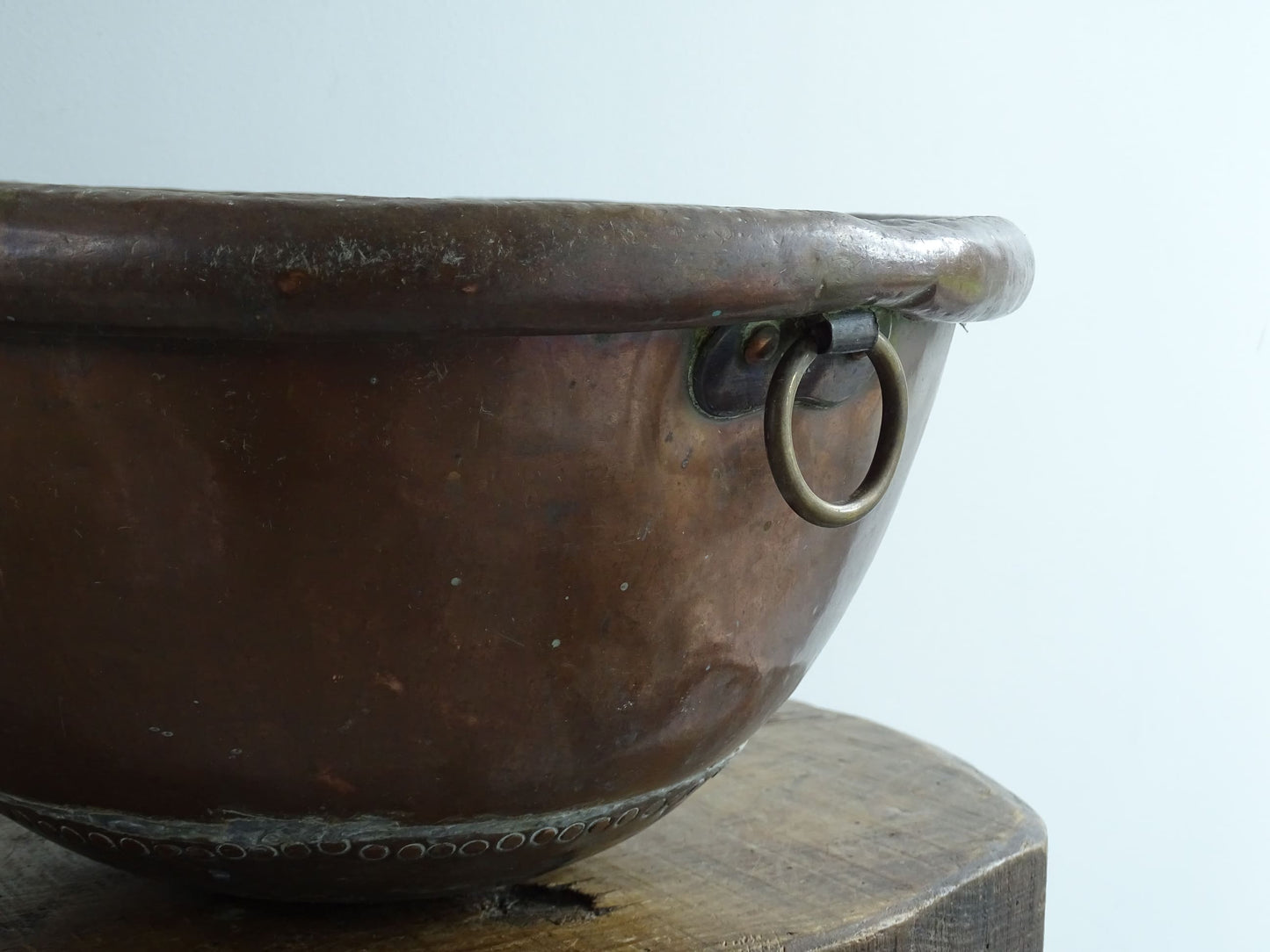 Antique French Copper Confectioner's or Mixing Bowl from the 18th Century. This timeworn copper bowl has a rolled top and copper rivets to the curved base.