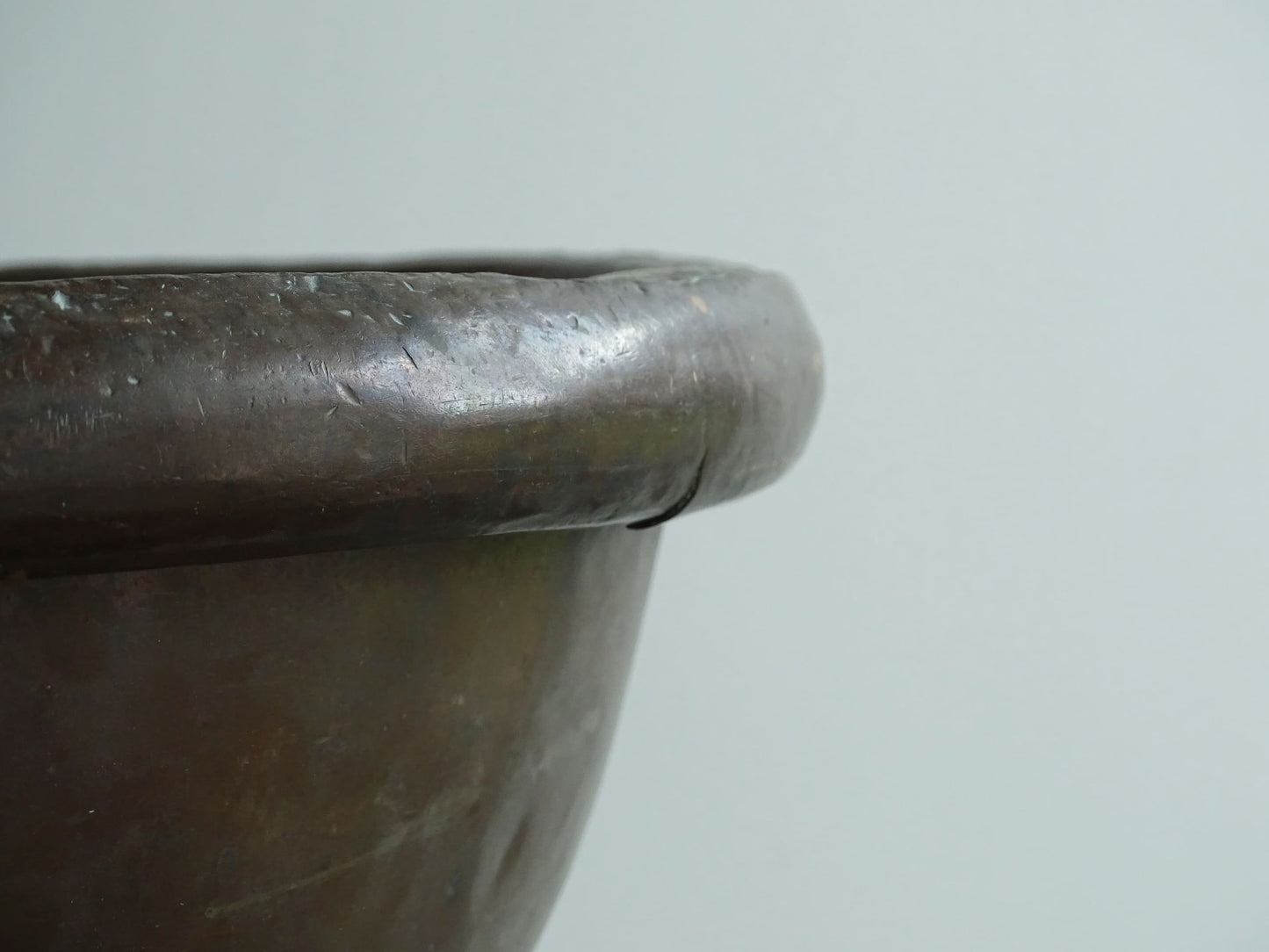 Antique French Copper Confectioner's or Mixing Bowl from the 18th Century. This timeworn copper bowl has a rolled top and copper rivets to the curved base.