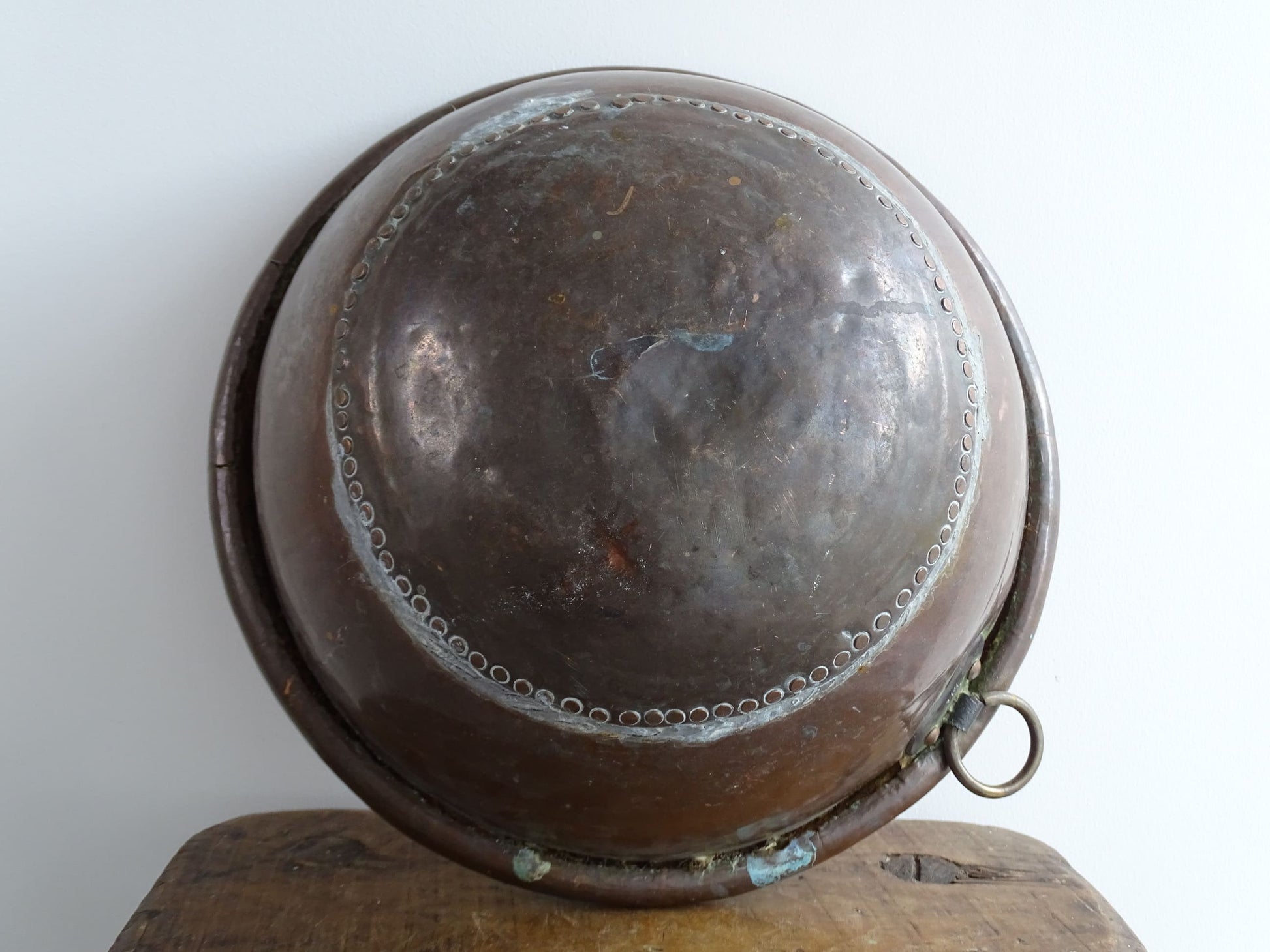 Antique French Copper Confectioner's or Mixing Bowl from the 18th Century. This timeworn copper bowl has a rolled top and copper rivets to the curved base.